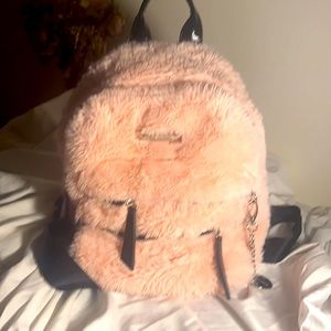 Steve Madden pink fluffy small backpack.